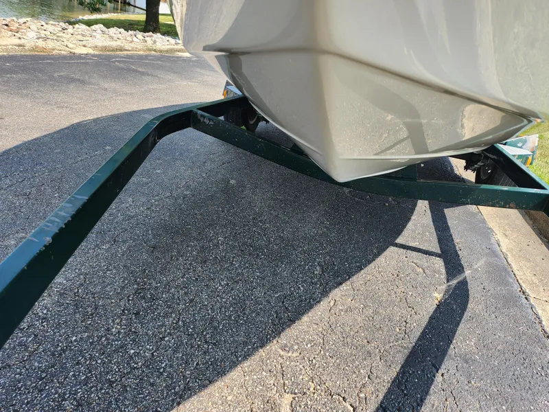 Slide: The Image of Crownline 192 BR 2000 boat on trailer, close-up view of hull and trailer frame. - 7