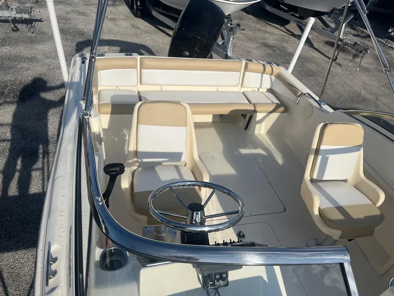 Slide: The Image of 2021 Scout 210 Dorado boat interior with beige and white seating. - 8