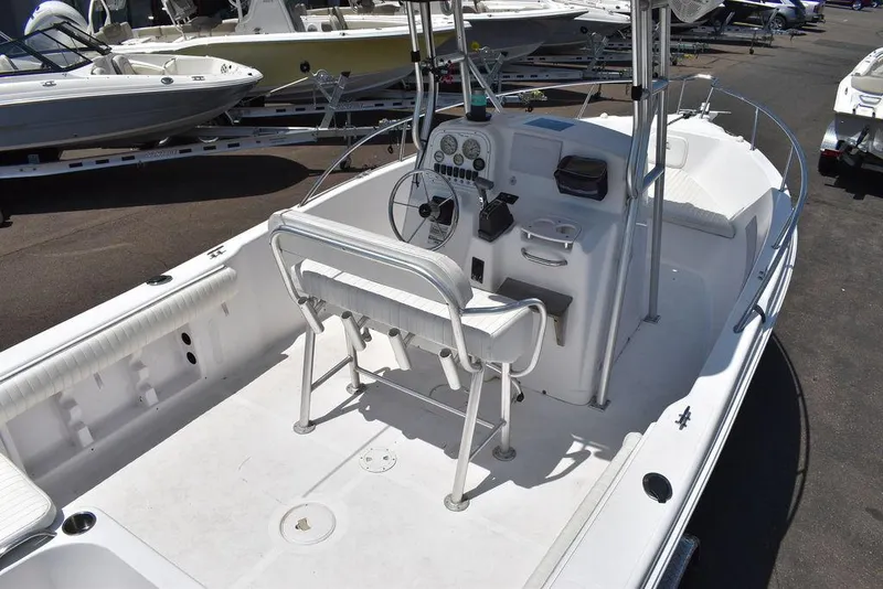 Slide: The Image of 2006 Pro-Line 21 Sport Center Console boat interior with steering console and seating. - 12