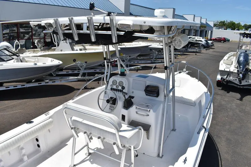 Slide: The Image of 2006 Pro-Line 21 Sport Center Console boat with T-top and fishing rod holders. - 13