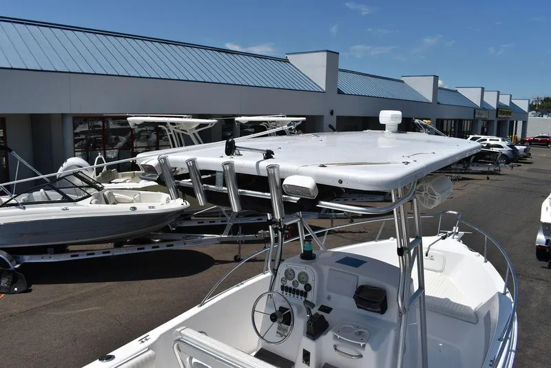 Slide: The Image of 2006 Pro-Line 21 Sport Center Console boat at a dealership. - 14