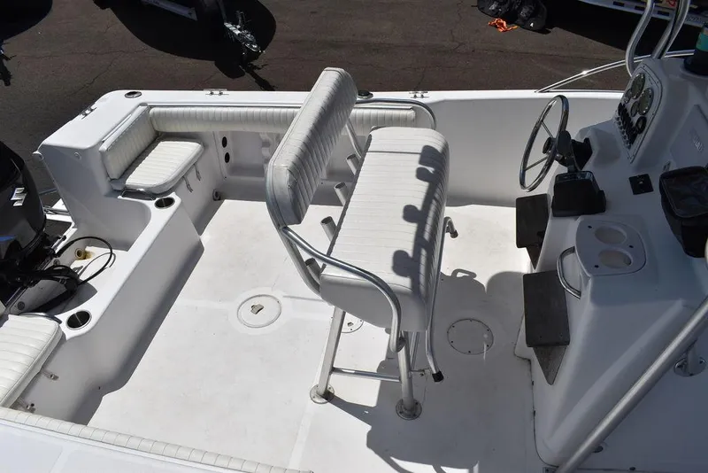 Slide: The Image of 2006 Pro-Line 21 Sport Center Console boat interior with seating and steering console. - 16