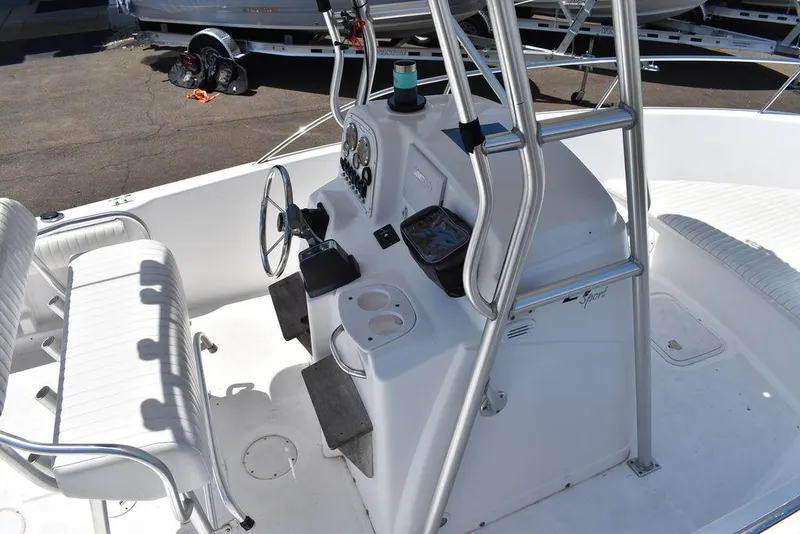 Slide: The Image of 2006 Pro-Line 21 Sport Center Console boat interior with steering wheel and seating. - 17