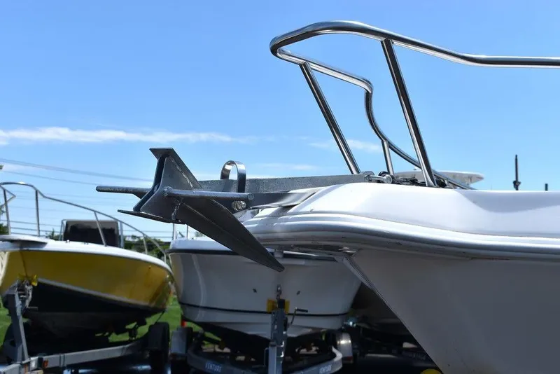 Slide: The Image of 2006 Pro-Line 21 Sport Center Console boat with anchor, docked on trailer. - 21