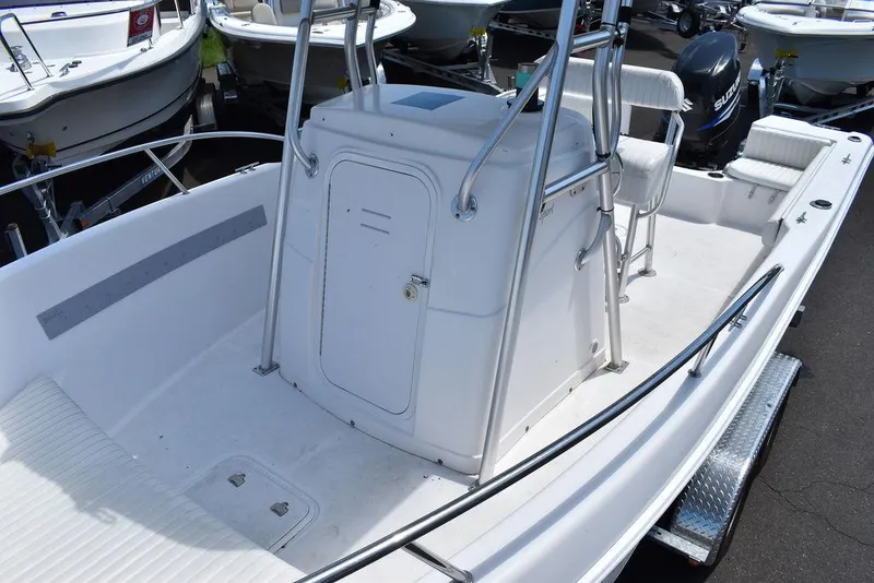 Slide: The Image of 2006 Pro-Line 21 Sport Center Console boat interior with seating and storage. - 22