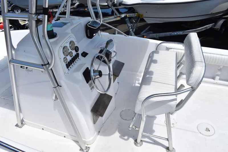 Slide: The Image of 2006 Pro-Line 21 Sport Center Console boat interior with steering wheel and seating. - 25