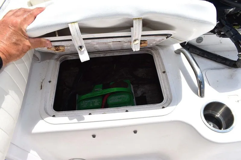 Slide: The Image of 2006 Pro-Line 21 Sport Center Console storage compartment with green battery inside. - 28