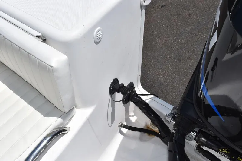 Slide: The Image of 2006 Pro-Line 21 Sport Center Console boat interior with engine and seating. - 31