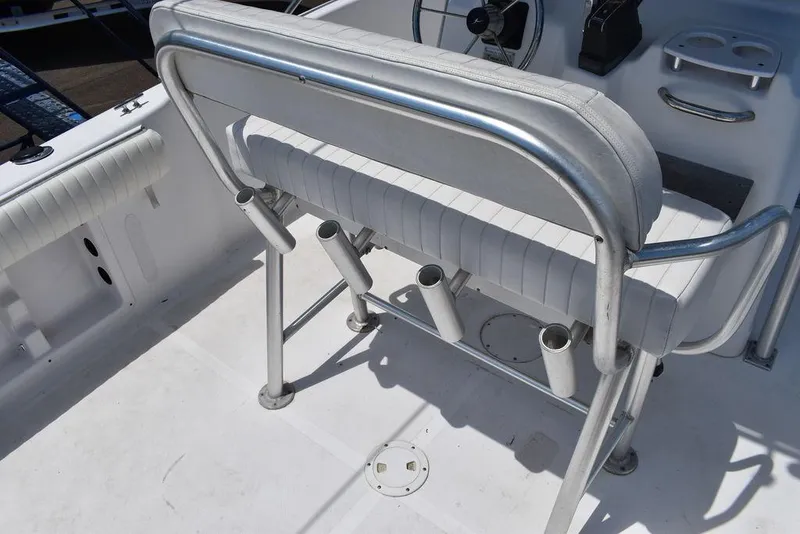 Slide: The Image of 2006 Pro-Line 21 Sport Center Console boat interior with seating and rod holders. - 32