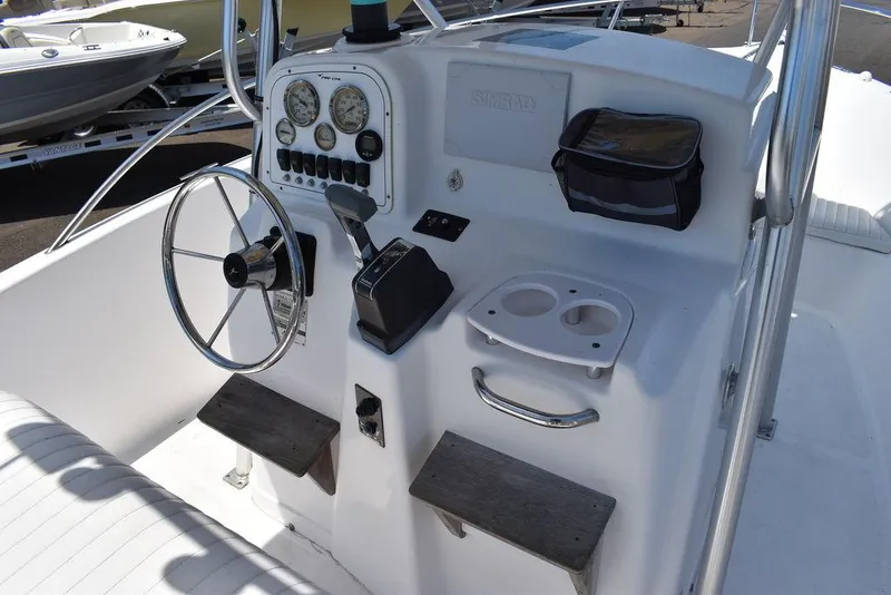 Slide: The Image of 2006 Pro-Line 21 Sport Center Console boat dashboard with steering wheel and instrument panel. - 34