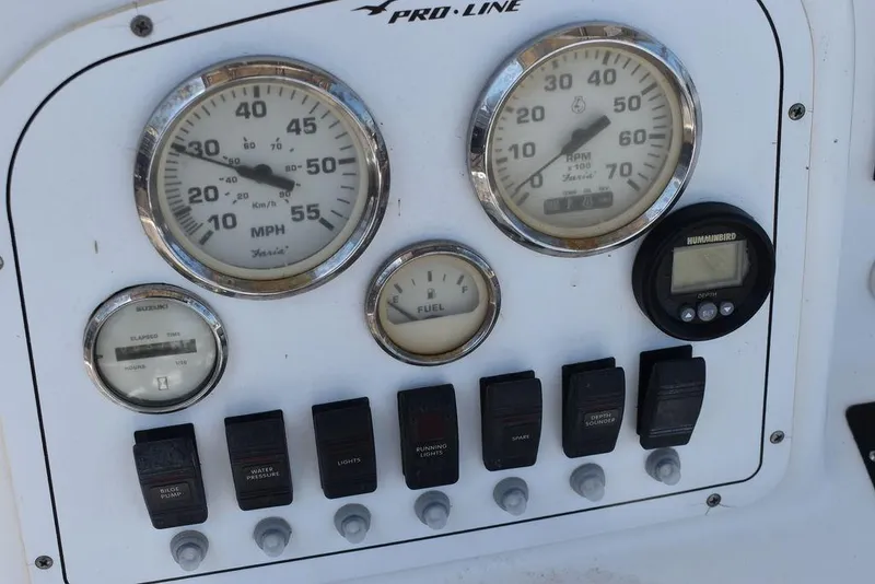 Slide: The Image of Dashboard of a 2006 Pro-Line 21 Sport Center Console boat with gauges and switches. - 37