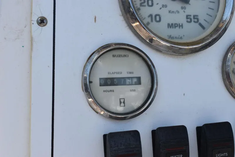 Slide: The Image of Close-up of 2006 Pro-Line 21 Sport Center Console Suzuki engine hour meter. - 39