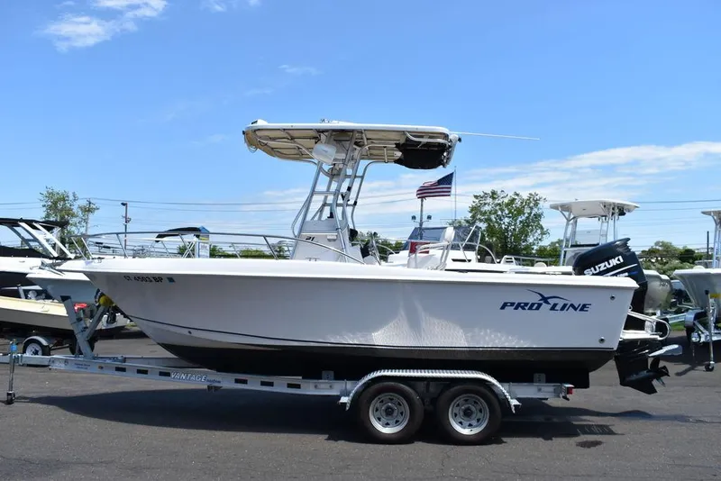 Slide: The Image of 2006 Pro-Line 21 Sport Center Console boat on trailer, side view. - 4