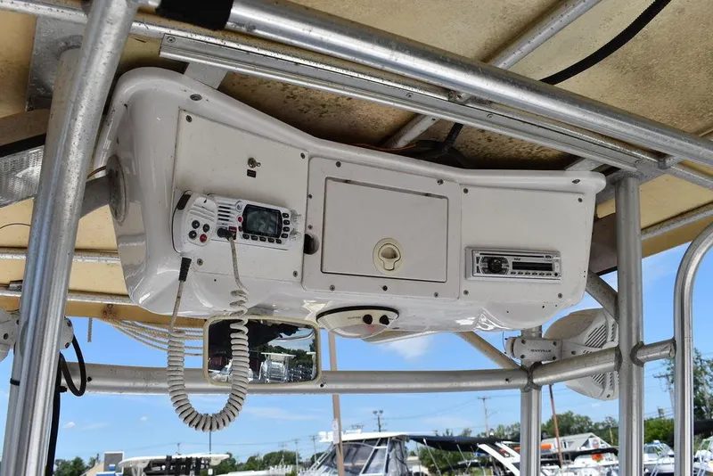 Slide: The Image of 2006 Pro-Line 21 Sport Center Console boat electronics and storage compartment. - 41