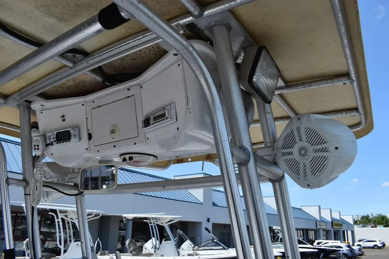 Slide: The Image of 2006 Pro-Line 21 Sport Center Console boat with overhead electronics and speakers. - 43
