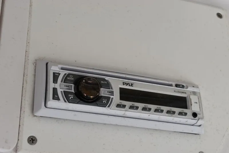 Slide: The Image of Pyle audio system in a 2006 Pro-Line 21 Sport Center Console boat. - 44
