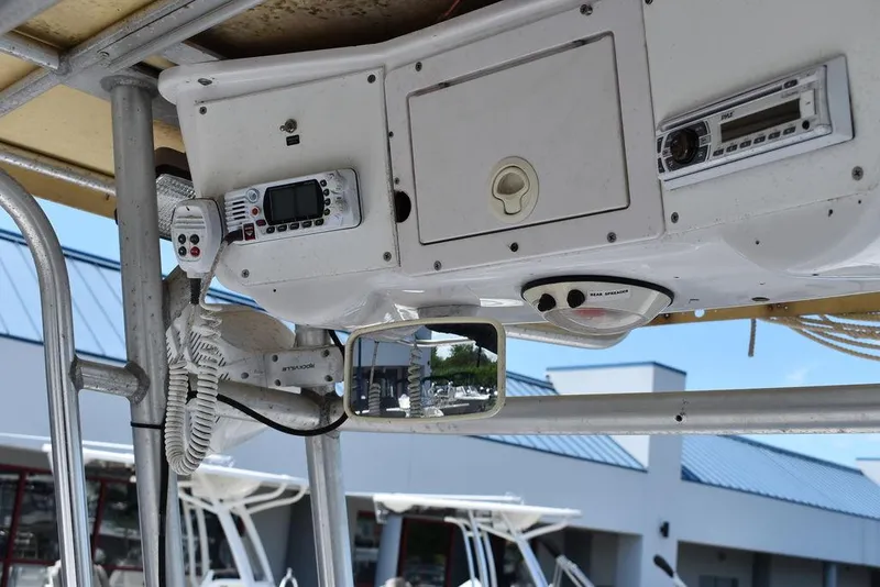 Slide: The Image of 2006 Pro-Line 21 Sport Center Console boat dashboard with electronics and controls. - 45