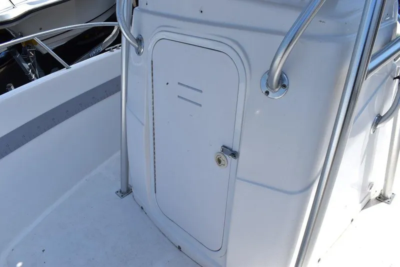 Slide: The Image of 2006 Pro-Line 21 Sport Center Console boat storage compartment with stainless steel railing. - 46