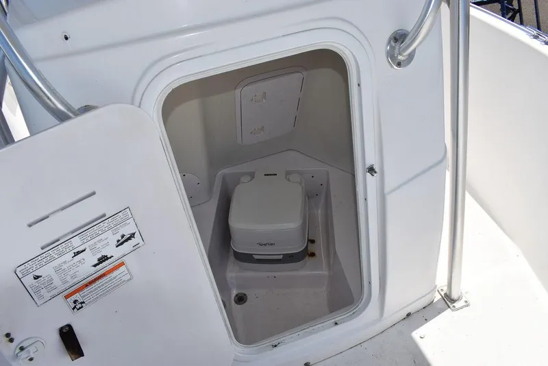 Slide: The Image of 2006 Pro-Line 21 Sport Center Console boat with onboard portable toilet. - 47
