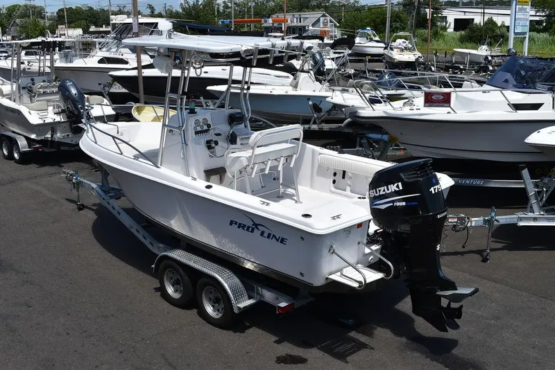 Slide: The Image of 2006 Pro-Line 21 Sport Center Console boat on trailer with Suzuki outboard motor. - 6