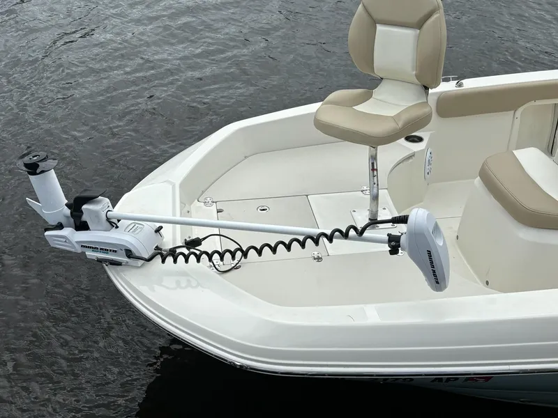 Slide: The Image of 2019 Stingray 186CC boat with trolling motor and cushioned seating. - 10