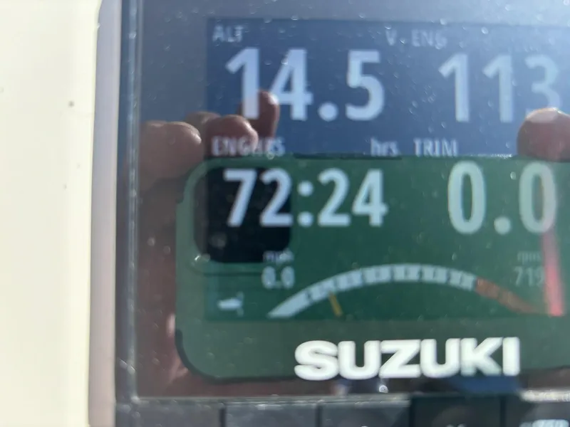 Slide: The Image of Suzuki engine display on a 2019 Stingray 186CC boat showing 72.24 engine hours. - 11