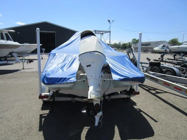 Slide: The Image of 2019 Stingray 186CC boat with blue cover on trailer. - 3