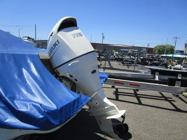 Slide: The Image of 2019 Stingray 186CC boat with Suzuki 115 outboard motor in a marina. - 4