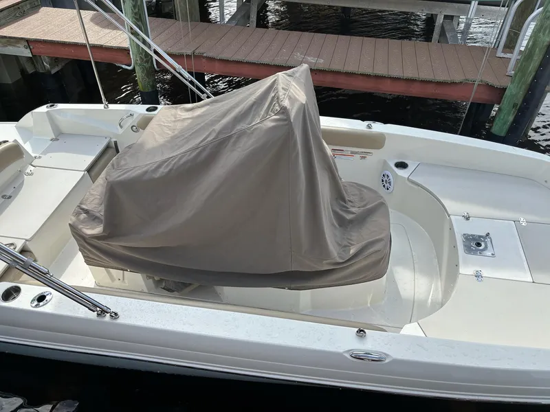 Slide: The Image of 2019 Stingray 186CC boat with covered console docked at marina. - 6