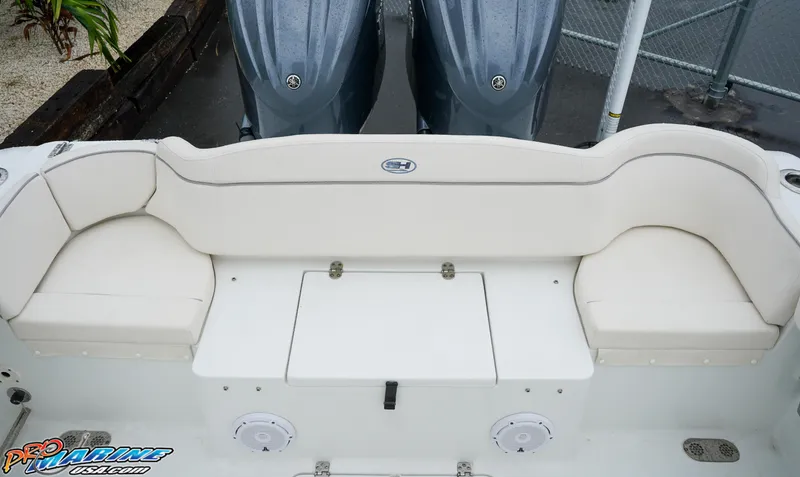 Slide: The Image of 2023 Sea Hunt Ultra 275 SE boat with dual engines and spacious seating. - 10