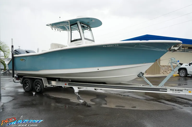 Slide: The Image of 2023 Sea Hunt Ultra 275 SE boat on trailer at Pro Marine dealership. - 2