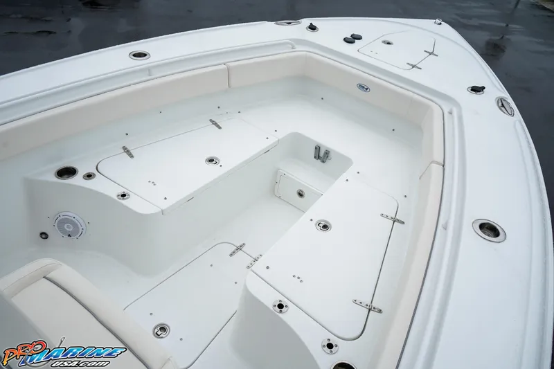 Slide: The Image of 2023 Sea Hunt Ultra 275 SE boat interior with spacious seating and storage compartments. - 21