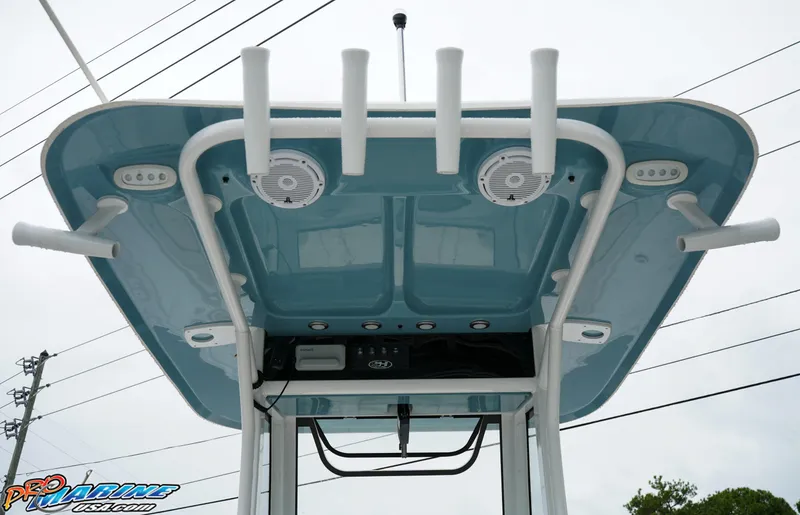 Slide: The Image of 2023 Sea Hunt Ultra 275 SE boat T-top with rod holders and speakers. - 28