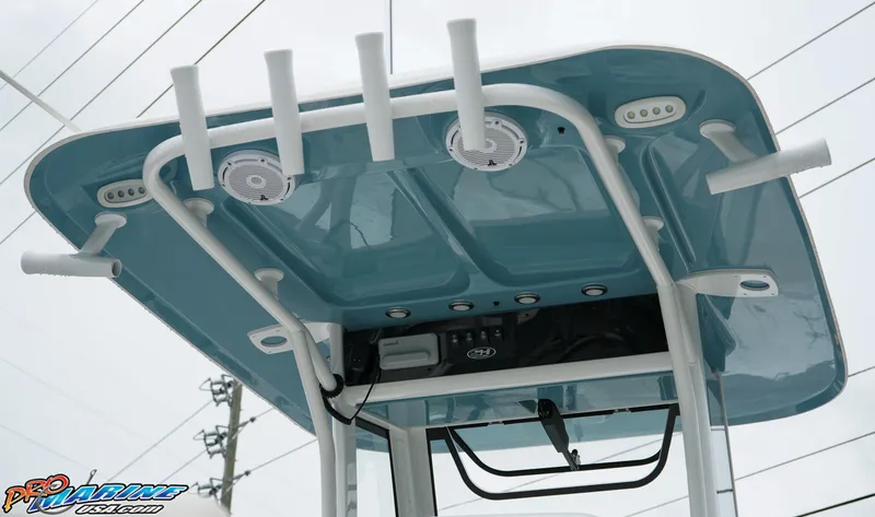 Slide: The Image of 2023 Sea Hunt Ultra 275 SE boat T-top with rod holders and speakers. - 7