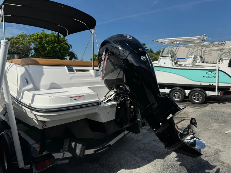 Slide: The Image of 2021 Bayliner VR5 Bowrider OB with outboard motor, parked on a trailer. - 3