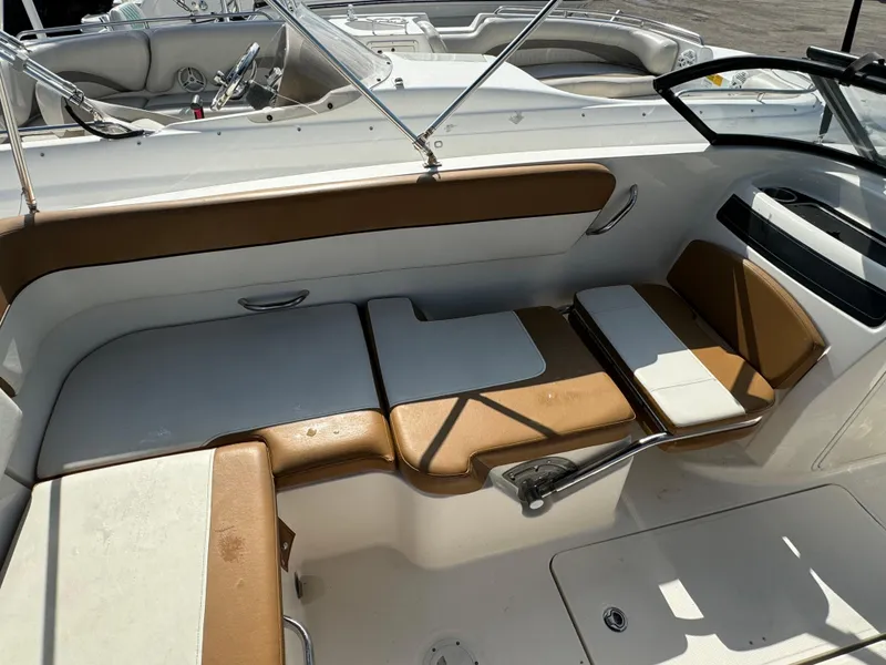 Slide: The Image of 2021 Bayliner VR5 Bowrider OB interior seating area with tan and white upholstery. - 4