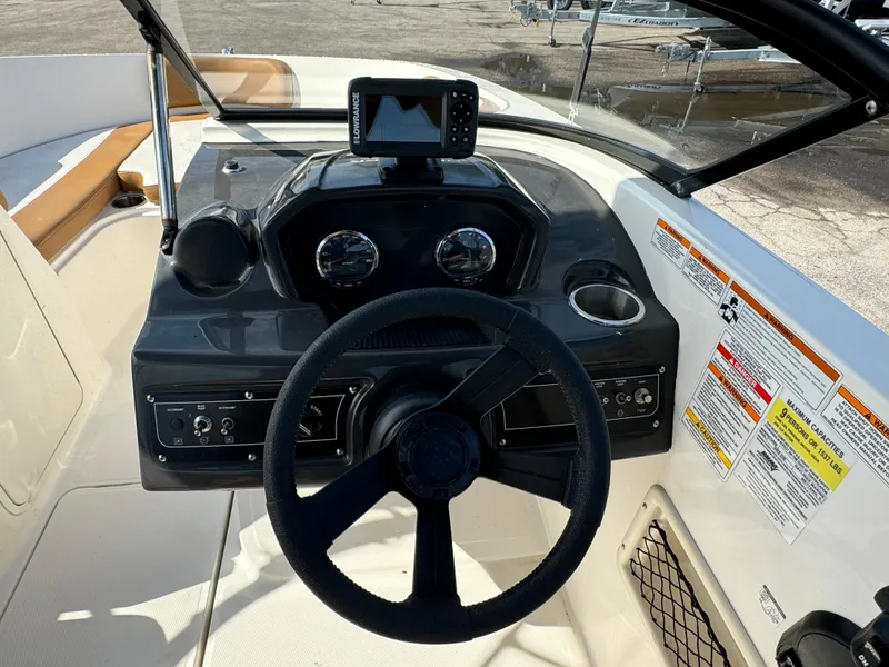 Slide: The Image of 2021 Bayliner VR5 Bowrider OB dashboard with steering wheel and navigation system. - 8