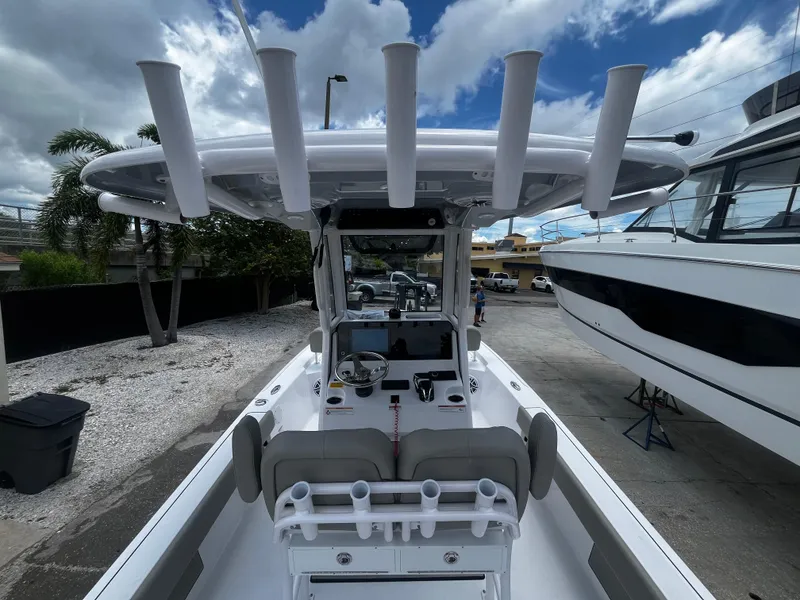 Slide: The Image of 2025 Sportsman Masters 227 Bay Boat with T-top and rod holders. - 10