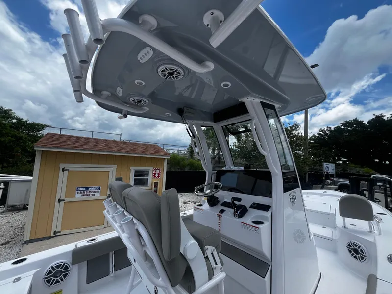 Slide: The Image of 2025 Sportsman Masters 227 Bay Boat with T-top and dual helm seats. - 11