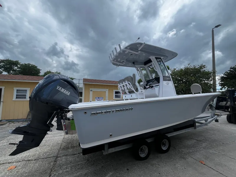 Slide: The Image of 2025 Sportsman Masters 227 Bay Boat with Yamaha outboard engine on trailer. - 2