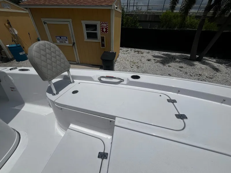 Slide: The Image of 2025 Sportsman Masters 227 Bay Boat deck with seating and storage compartments. - 20