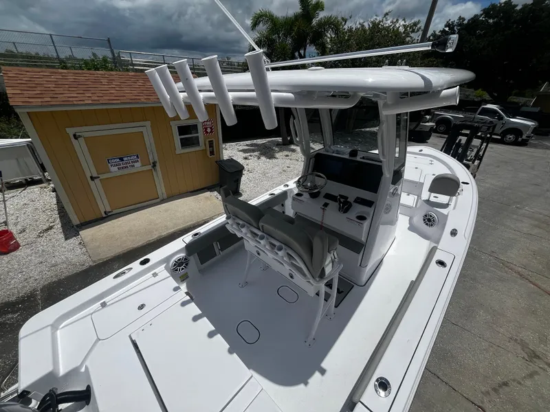 Slide: The Image of 2025 Sportsman Masters 227 Bay Boat with center console and rod holders. - 21