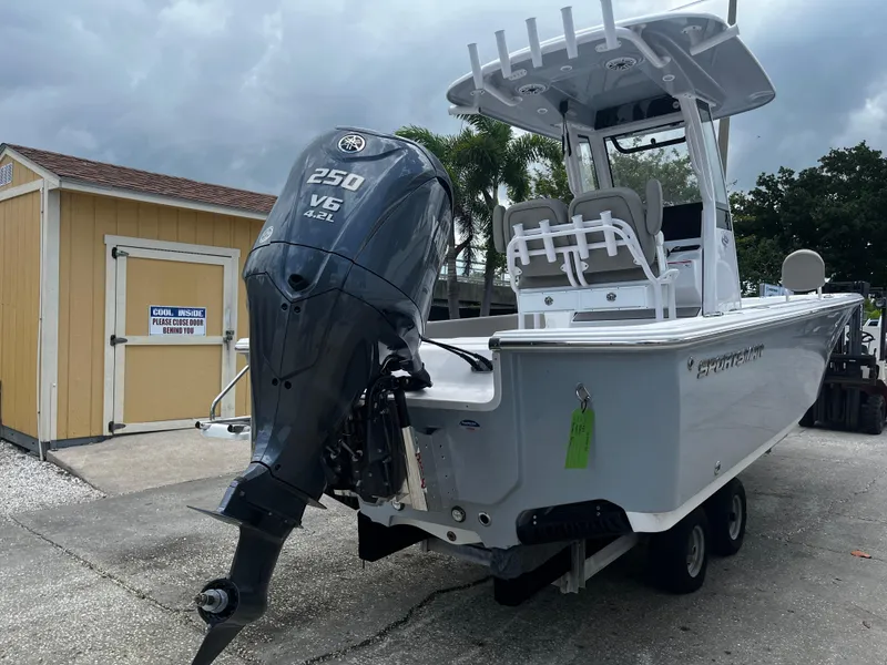 Slide: The Image of 2025 Sportsman Masters 227 Bay Boat with 250 V6 engine, parked on a trailer. - 3