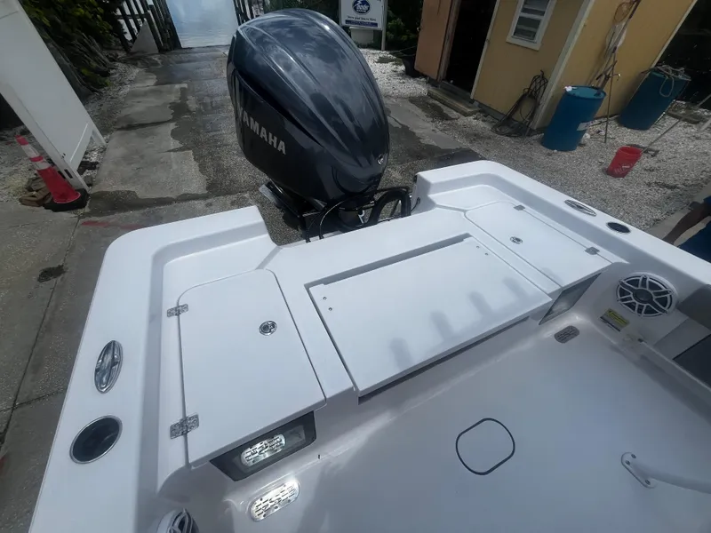 Slide: The Image of 2025 Sportsman Masters 227 Bay Boat with Yamaha outboard motor, rear deck view. - 8