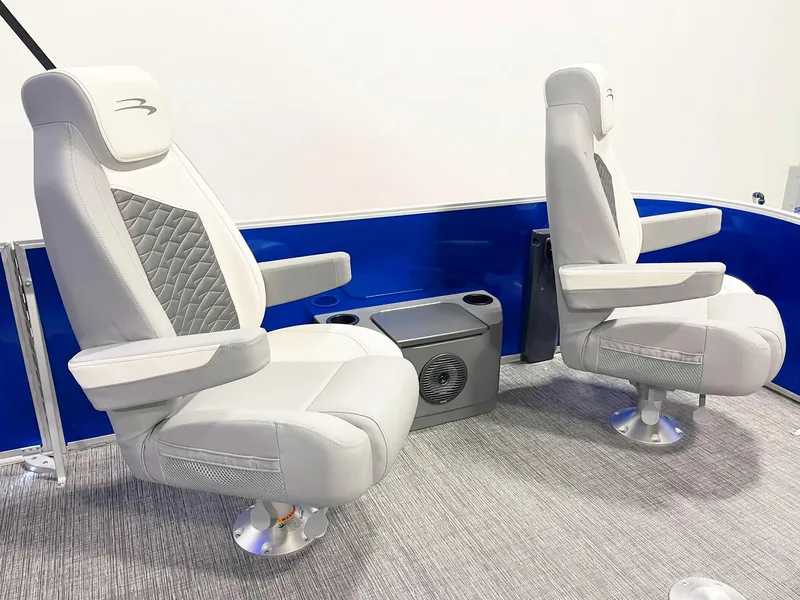 Slide: The Image of Luxury seating on 2025 Bennington 20S pontoon boat with blue accents. - 11