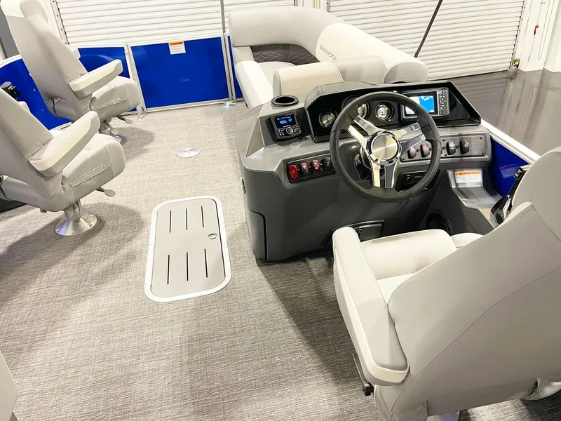 Slide: The Image of 2025 Bennington 20S pontoon boat interior with modern helm and comfortable seating. - 8