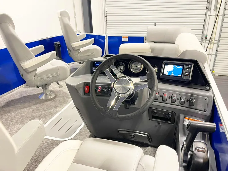 Slide: The Image of Interior of 2025 Bennington 20S boat with modern dashboard and comfortable seating. - 9