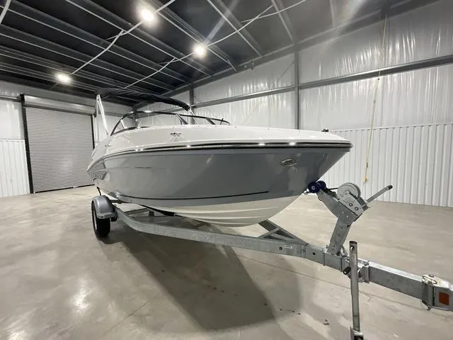 Slide: The Image of 2024 Bayliner VR5 Bowrider boat on a trailer in a storage facility. - 12