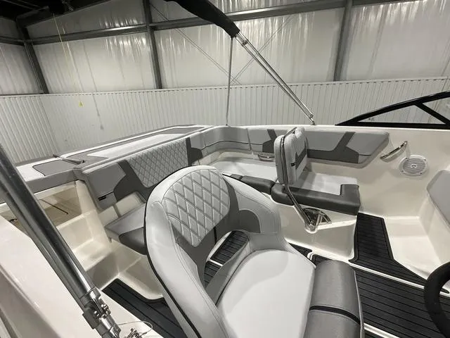 Slide: The Image of 2024 Bayliner VR5 Bowrider interior with modern seating and sleek design. - 4