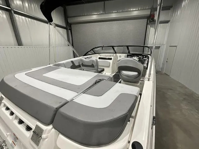 Slide: The Image of 2024 Bayliner VR5 Bowrider in a storage facility, showcasing spacious seating and sleek design. - 5